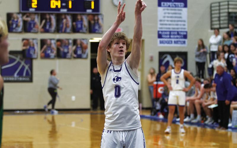 HUNTER KING | DISPATCH RECORD Peyton Sisson releases a free throw during the first half of the Burnet game.
