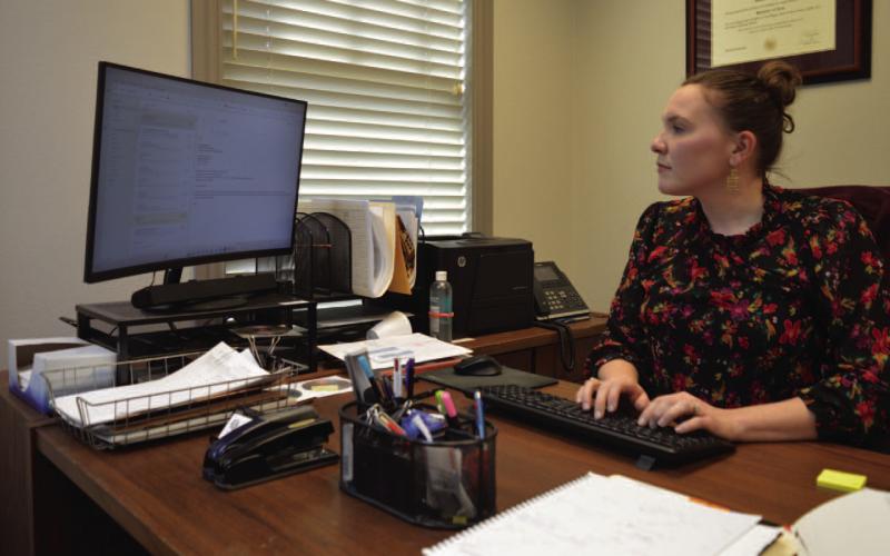 County Attorney Jessica Guy works from her desk at the Lampasas County Office Building. ERICK MITCHELL | DISPATCH RECORD