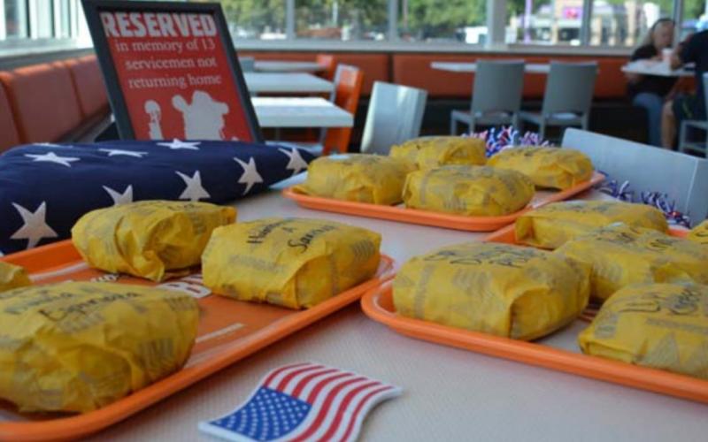 The 13 servicemembers killed in Afghanistan last week are honored inside the new Whataburger on Key Avenue. MONIQUE BRAND | DISPATCH RECORD
