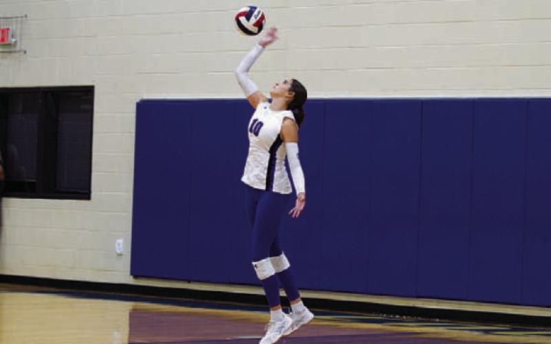 Ysa Swain swings through a serve in this week’s match. HUNTER KING | DISPATCH RECORD