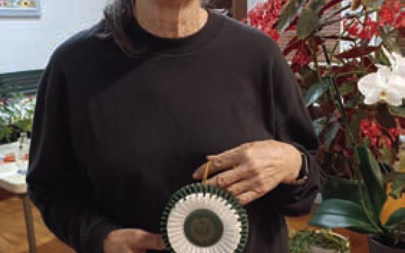 Tico Hicks received the Sweepstakes Award for having the most blue ribbons in the flower show. COURTESY PHOT0