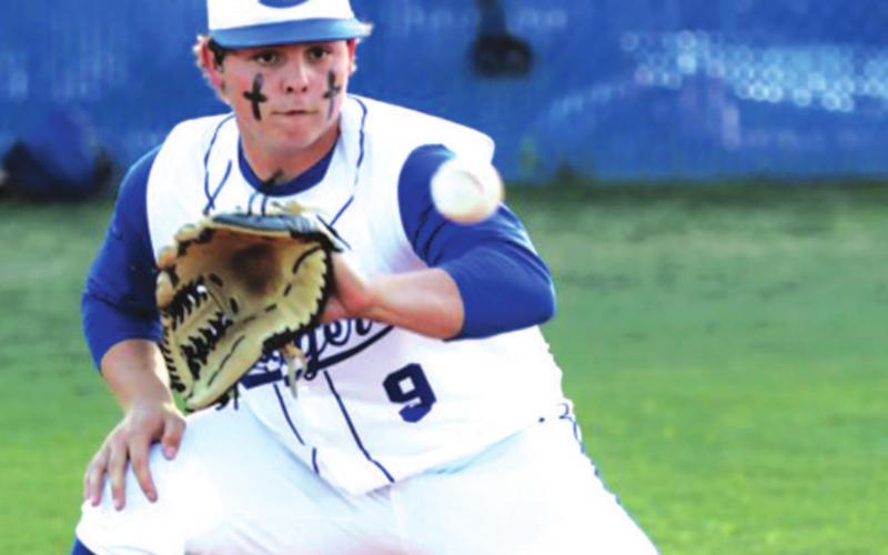 Avery Smith squares up to catch a ball thrown to third during last Friday’s game.  Chris Miles | COURTESY PHOTO