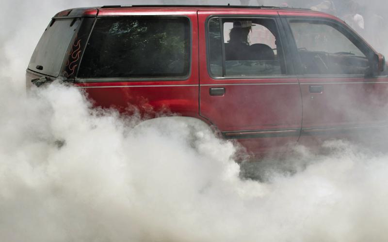 Smoke from the burnout competition is thick enough to obscure the cars competing. JOSEPH NEUENSCHWANDER | DISPATCH RECORD