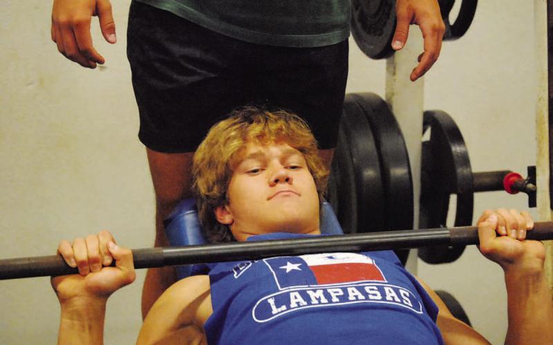 FILE PHOTO Haegan Oncken lifts weights during last summer’s SWAT workouts.