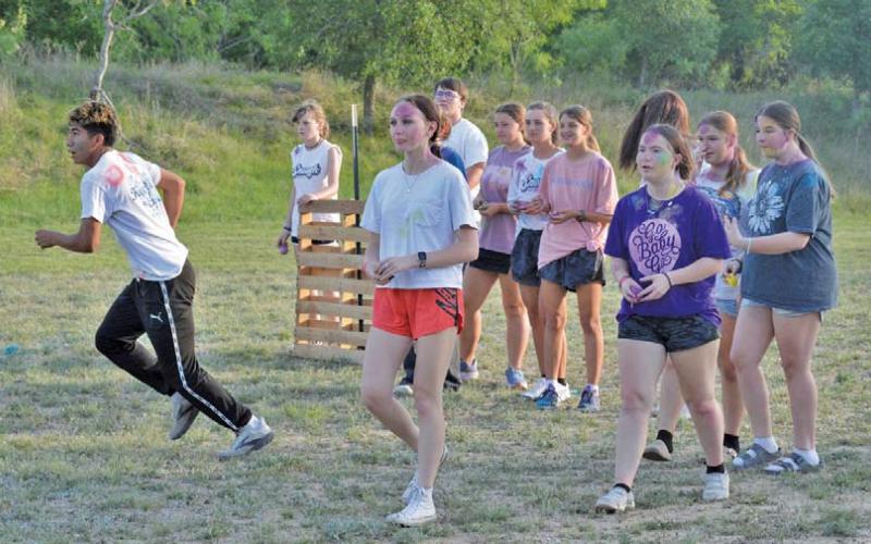 Young Life youth had fun outdoors during Monday’s paint wars activity. erick mitchell | dispatch Record