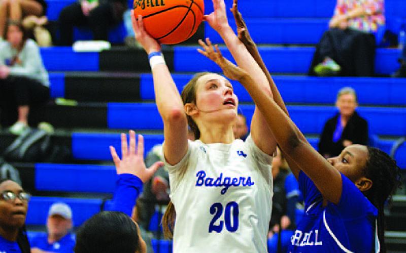 HUNTER KING | DISPATCH RECORD Lainey Dixon shoots over a Jarrell defender for two points.