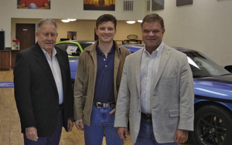 Three generations of the Benny Boyd family will celebrate the local car dealership’s 30th anniversary with a special barbecue for the public on Friday. Pictured here are Benny Boyd Sr., grandson Blaine Boyd and Benny Boyd Jr. ERICK MITCHELL | DISPATCH RECORD