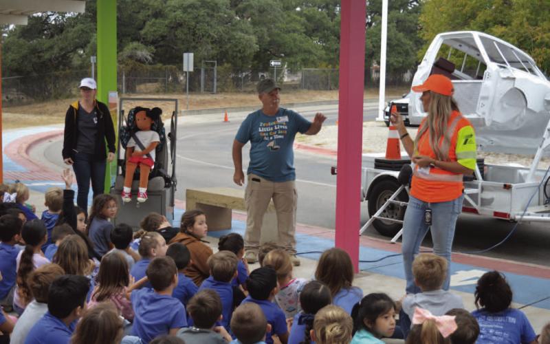 Lampasas County resident and child passenger safety technician Paul Miceli talks with Hanna Springs Elementary School students earlier this school year about the importance of car seat safety. COURTESY PHOTO