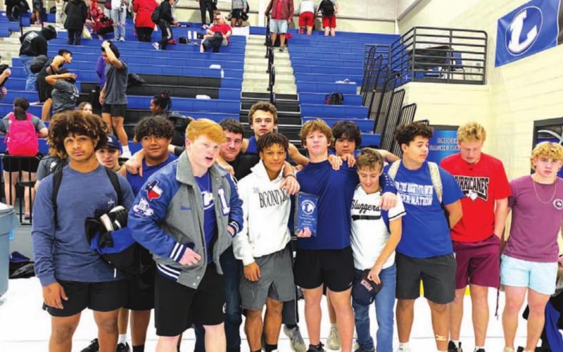 The boys’ powerlifting team poses for a photo after winning their home meet earlier this year. COURTESY PHOTO