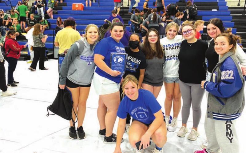 The Lady Badger powerlifters pose for a photo at the Lampasas High School gym. COURTESY PHOTO