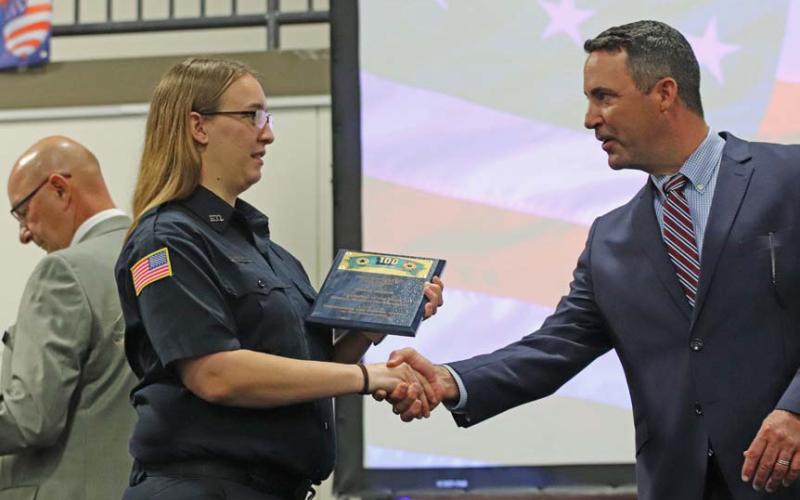 Bailey Harner is awarded Firefighter of the Year honors for Kempner Volunteer Fire Department. She accepts her award from 424th District Court Judge Evan Stubbs. COURTESY PHOTO | HILL COUNTRY 100 CLUB