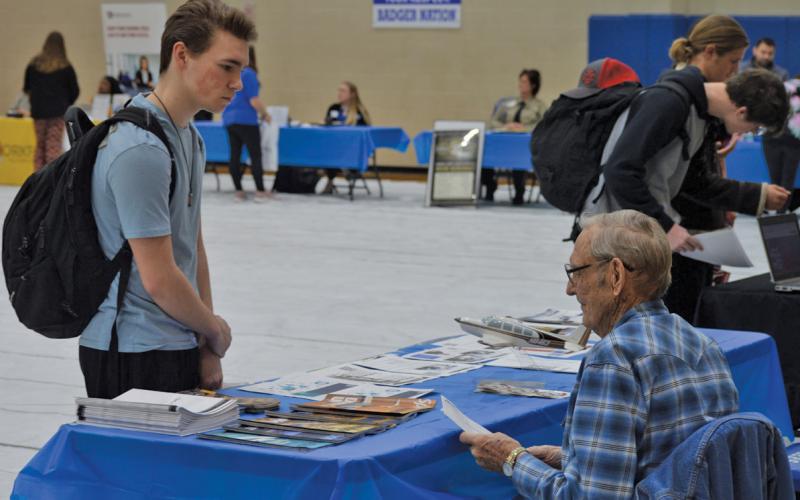 erick mitchell | dispatch record At left, Jason Brock speaks with a representative from the Lampasas County Pilot’s Association during the high school job fair last week.