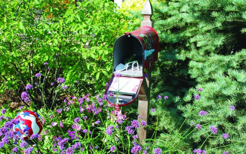 This old mailbox is filled with garden tools and is set in the garden for convenient access to make maintenance tasks easier to accomplish. COURTESY PHOTO | WWW.MELINDAMYERS.COM