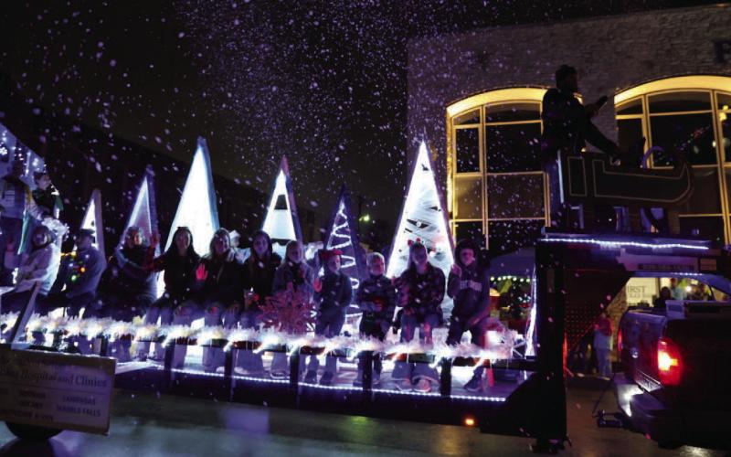 Spectators had a extra treat at this year’s Christmas parade as “snow” graced the sky on Saturday evening. JOYCESARAH MCCABE | DISPATCH RECORD