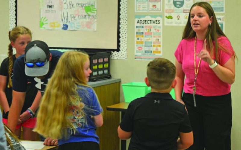Hanna Springs Elementary School second-grade teacher Taylor Richard welcomes students to their new classroom. ERICK MITCHELL | DISPATCH RECORD