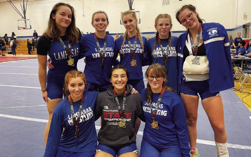 The girls’ wrestling team poses with their medals from last week’s tournament in Georgetown. COURTESY PHOTO | LISD ATHLETICS