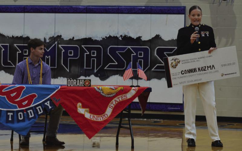 Connor Kozma is presented a $180,000 check for his Naval ROTC scholarship to become a commissioned officer in the Marines after college graduation. ERICK MITCHELL | DISPATCH RECORD