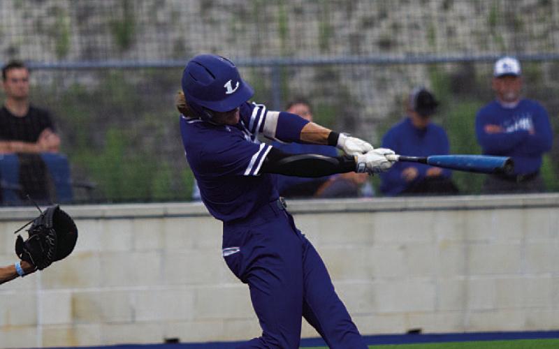 Timber Gholson hits a line drive into the outfield for a hit against the Vikings. HUNTER KING | DISPATCH RECORD