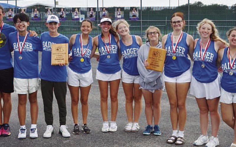 COURTESY PHOTO | KENNETH PEISER Junior varsity tennis poses with their plaques and medals from the district tournament.