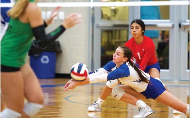 HUNTER KING | DISPATCH RECORD Landry White dives for a dig during the second set against Burnet.