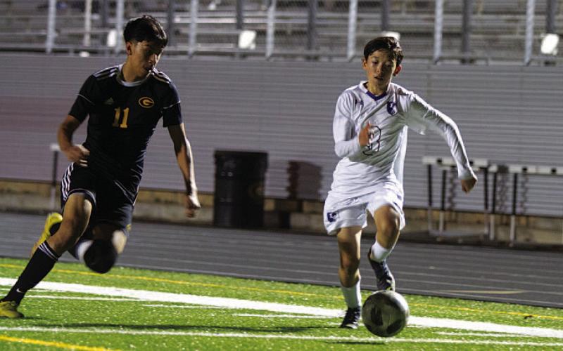 Kent Ashley dribbles past a Gatesville defender in the second half of Monday’s match. HUNTER KING | DISPATCH RECORD