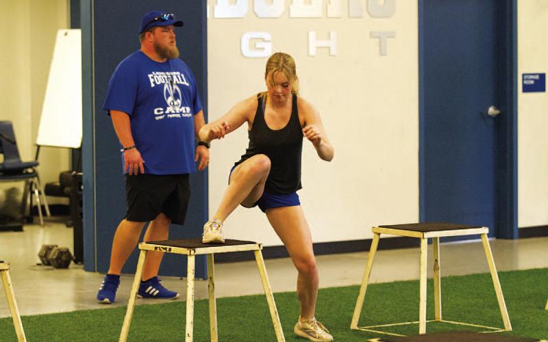 Scout Barton works on box steps as coach Donovan Kleckner leads the group. HUNTER KING | DISPATCH RECORD