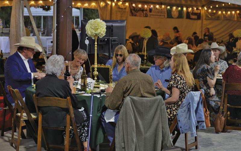Attendees enjoy a catered dinner during LAFTA’s annual Boots and Blazers Ball on Saturday. The event serves as the local non-profit’s primary fundraiser of the year. ERICK MITCHELL | DISPATCH RECORD