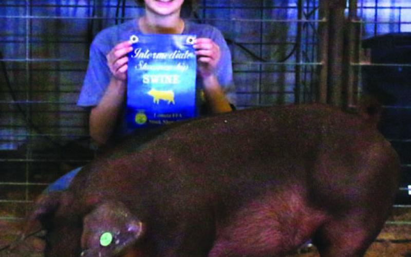 This year’s intermediate swine showmanship winner was Paeton Singleton. MASON HINES | DISPATCH RECORD