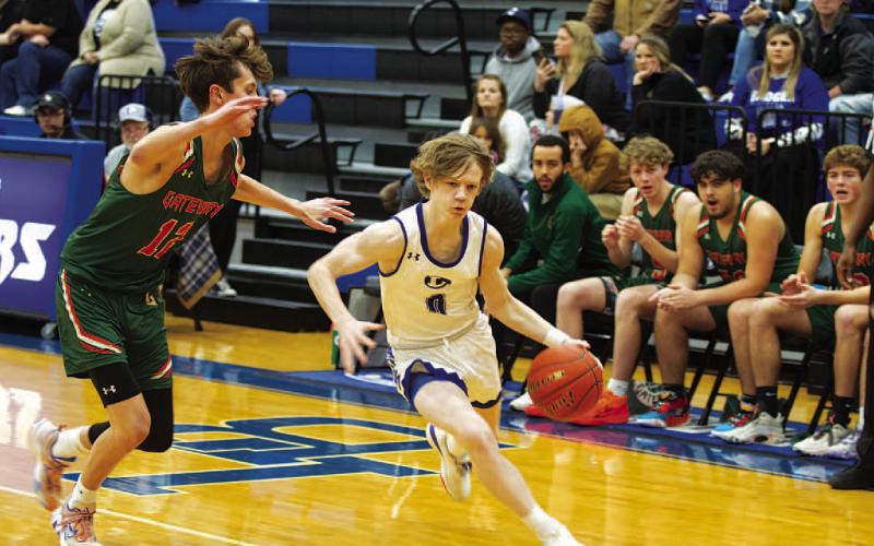 Peyton Sisson drives past a Gateway defender. The freshman scored 15 points in last Friday’s game. HUNTER KING | DISPATCH RECORD