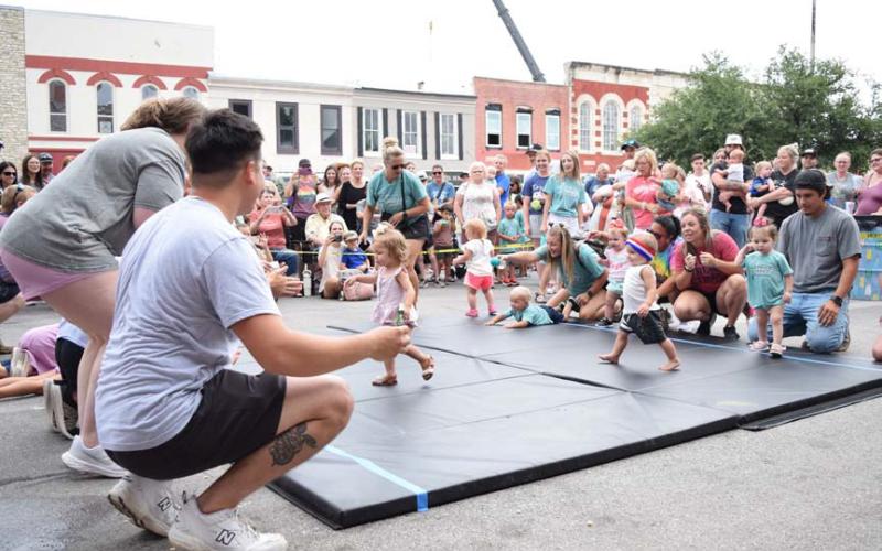 ALEXANDRIA RANDOLPH | DISPATCH RECORD Families from across the county and nearby communities gathered to watch babies vie in crawling and toddling races at the Lampasas courthouse square.