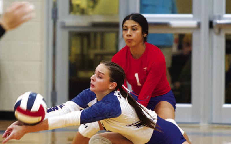 Landry White (front), and Arielle Aguirre were both seniors on this year’s volleyball team. HUNTER KING | DISPATCH RECORD
