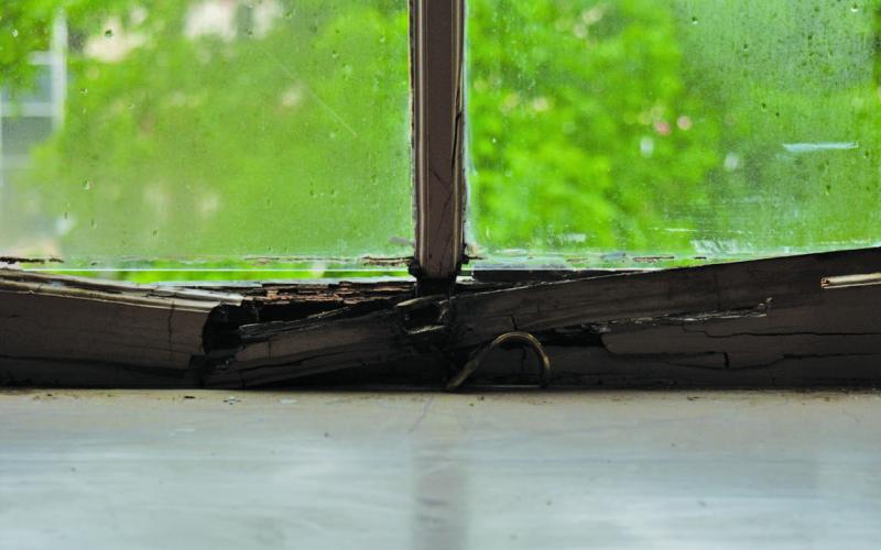ERICK MITCHELL | DISPATCH DISPATCH A view from one of the windows in the upstairs courtroom shows rotten wood. This is just one of the many windows Lampasas County Judge Randy Hoyer has noticed in need of repairs. The Lampasas County Commisioners Court discussed courthouse renovations in a workshop on April 22.