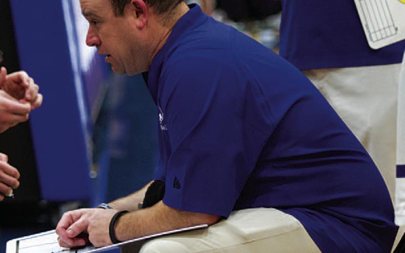 HUNTER KING | DISPATCH RECORD Aaron Nuckles coaches his team during a timeout.