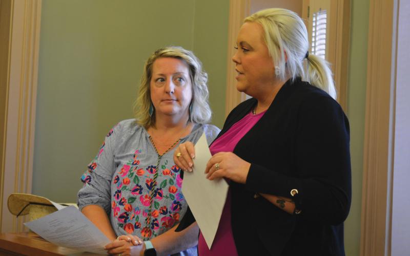 Lampasas County Chamber of Commerce Executive Director Melissa Unger, left, and Molly Faught of the Lampasas Downtown Association address changes coming for the downtown merchants group. erick mitchell | dispatch record