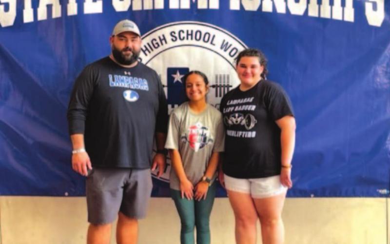 Lila Walling, right, Nimsi Vergara and Tyler Cleavinger pose for a photo at the state powerlifting meet last week. HUNTER KING | DISPATCH RECORD