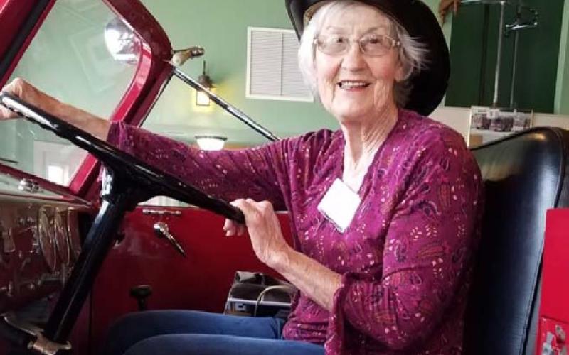 Nancy Kahlstrom of Lampasas, a Central Texas Travel Club member, is shown on a 1950 American LaFrance 750-gpm pumper known as “Invader” at Brenham Fire Department #1 while on a recent tour of Brenham and Chappell Hill. COURTESY PHOTO