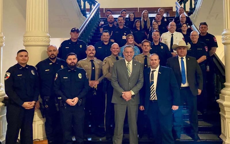 District 68 State Rep. David Spiller, in center, stands with a group of emergency responders who assisted with a river rescue last month when two Kempner-area boys were trapped in a cave. The Texas House passed HR 1080 last week to recognize the service of these first responders. courtesy photo