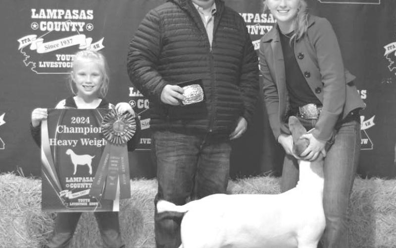 Brylie Turner, at right, showed the grand champion market goat in this year’s show and was the recipient of the Klose Sportsmanship Award. ERICK MITCHELL | DISPATCH RECORD