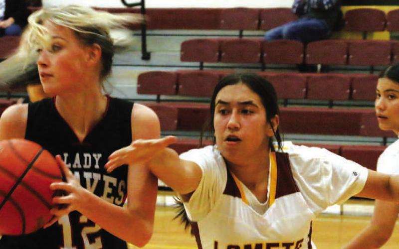 Mia Crain plays some tough defense against a Three Way player during Lometa’s 34-29 win. MASON HINES | DISPATCH RECORD