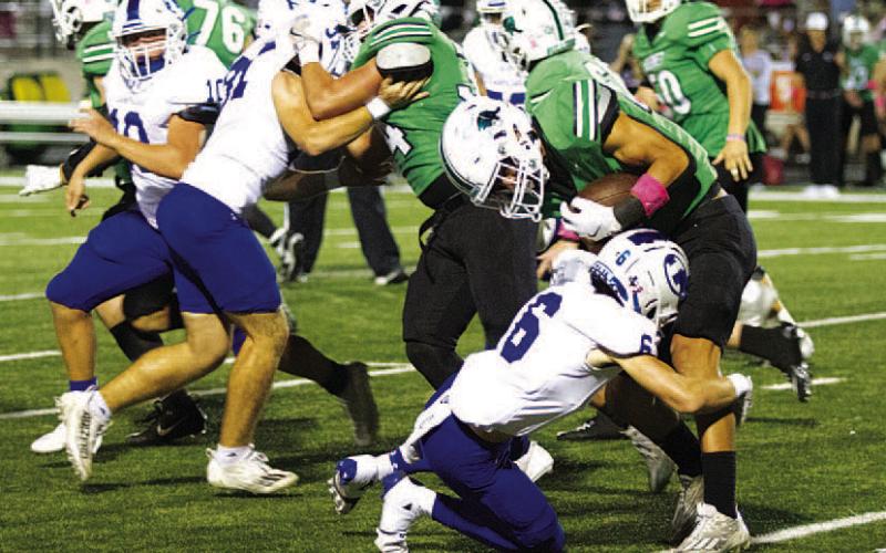 HUNTER KING | DISPATCH RECORD Connor Kozma makes a tackle in the backfield against Burnet. He and the rest of the Badger secondary will have their hands full this week.