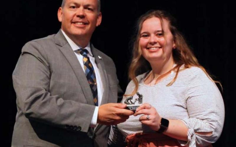 Howard Payne University President Dr. Cory Hines presents the HPU Servant Leadership Award to McKennah Randall. COURTESY PHOTO