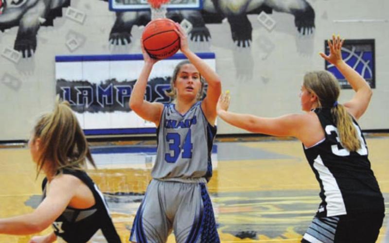 Jamie Ball looks for a teammate to pass to in Monday’s game. HUNTER KING | DISPATCH RECORD