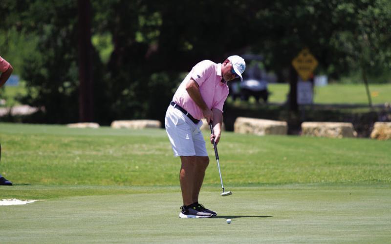 Mike Wiley follows through on a putt on a hole in the 2025 Memorial. HUNTER KING | DISPATCH RECORD