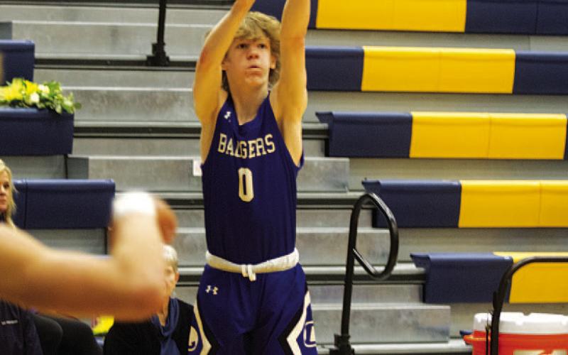 HUNTER KING | DISPATCH RECORD Peyton Sisson releases a three-point shot from the right wing.