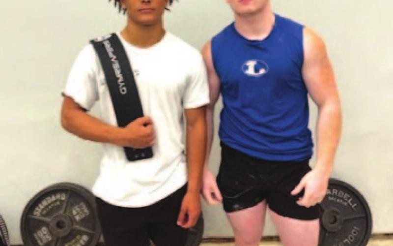 Dominique Wooten, left, and Westen Reid, pose for a photo at the state powerlifting meet over the weekend. COURTESY PHOTO