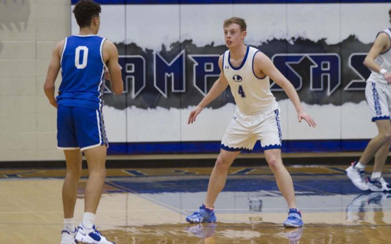 Quinn Pace plays defense on a Whitney guard during last Friday’s contest. Pace has scored in double digits in his last two games. HUNTER KING | DISPATCH RECORD