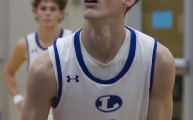 Kaeden Crawford prepares to shoot a free throw in his first game back with the Badgers for the 2021 season. HUNTER KING | DISPATCH RECORD