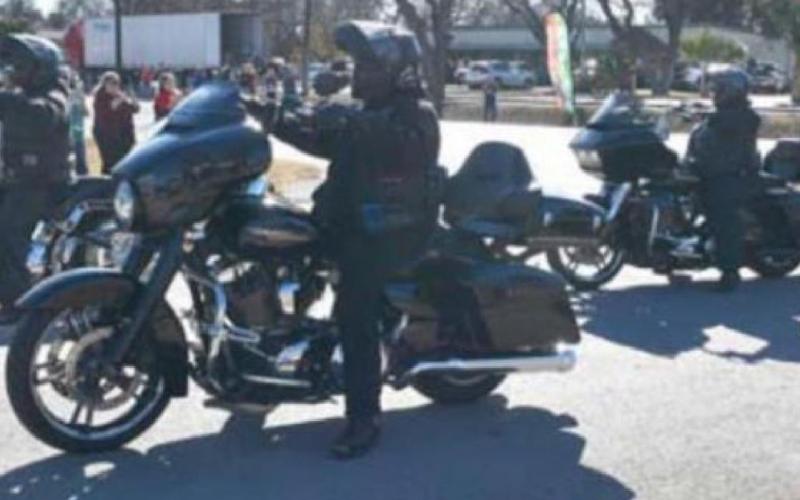 Motorcycles pull into the Putters &amp;amp; Gutters Fun Center parking lot in December 2020 as part of the annual Tri-County Toy Run. FILE PHOTO