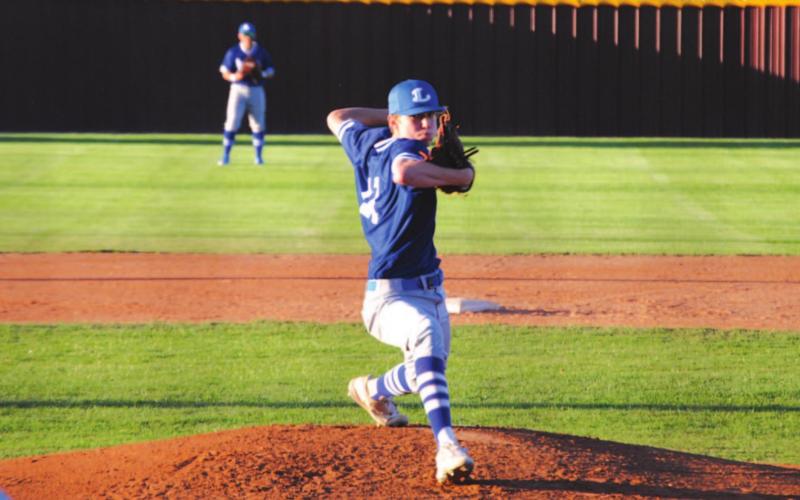 Jonas Andersen reaches to deliver a pitch during a previous start against Brownwood last week. HUNTER KING | DISPATCH RECORD