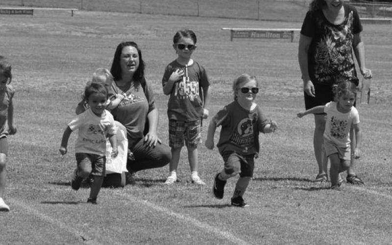 Children hit top gear during their races at the Gavin Garrett Soccer Complex for Spring Ho Kids’ Day festivities. Erick Mitchell | Dispatch Record
